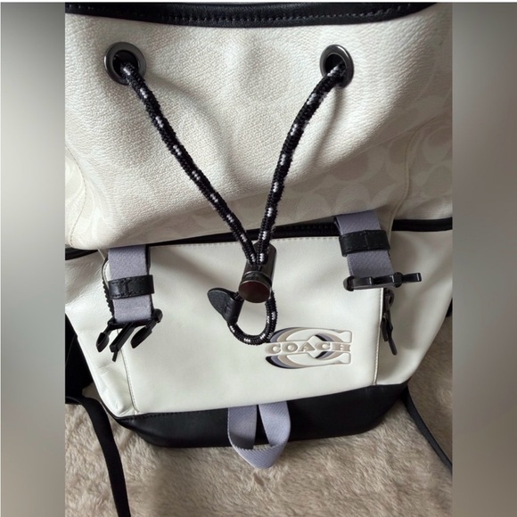 coach backpack track Sports - and Field Coaching Backpack Signature coated canvas and smooth calf leather Inside zip pocket Zip closure fabric lining Outside pocket with speedclip closure Adjustable shoulder strap with 42 length for crossbody wear (clip left or right) 7 1/4 (L) x 10 3/4 (H) x 2 1/4 (W) Style No. coach Track Backpack In Colorblock